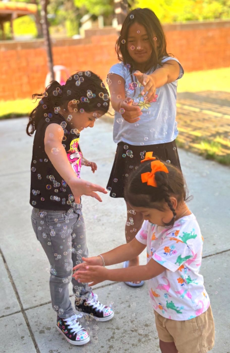 Two classmates hugging outdoors