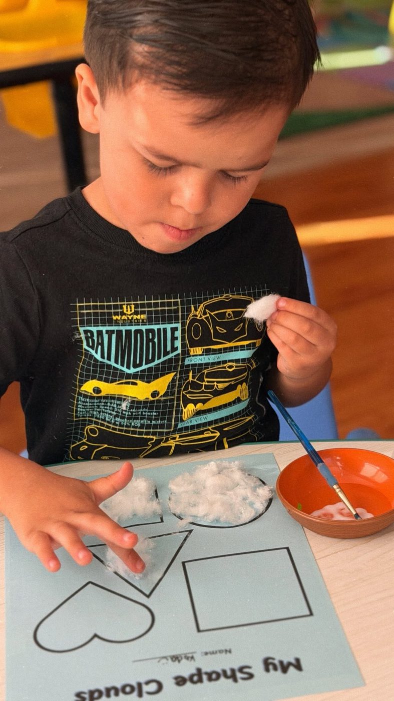 A child completing a shapes activity