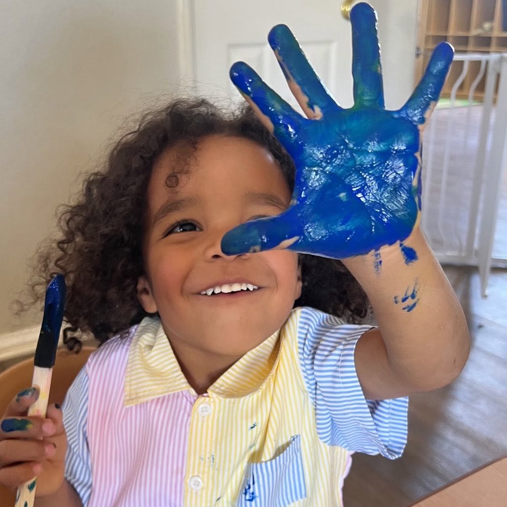 Young artists painting at the art station