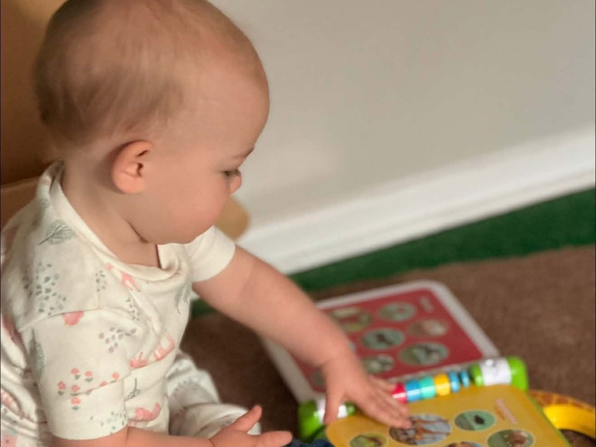 Toddler classroom with wooden toys and low shelves